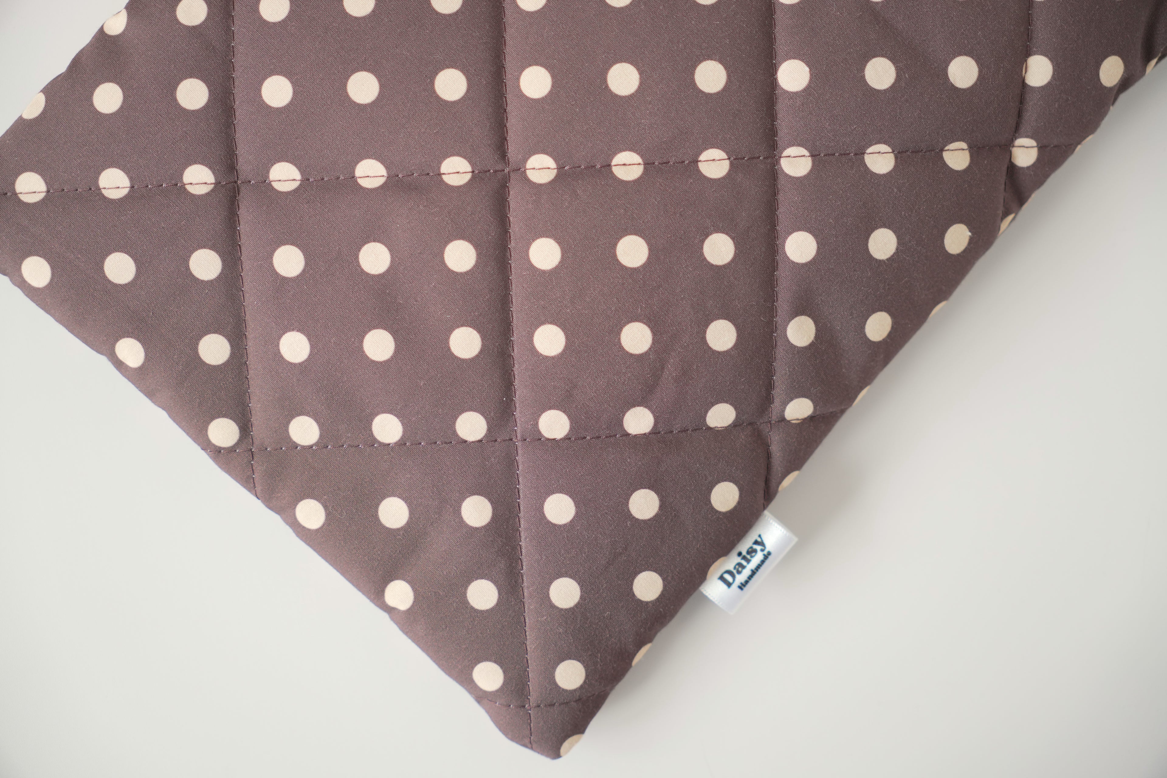Quilted brown and yellow polka dot book sleeve