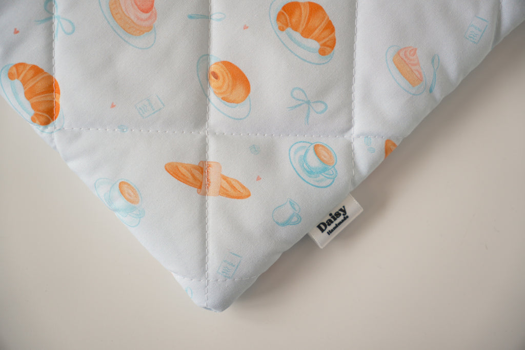 Quilted blue bakery book sleeve