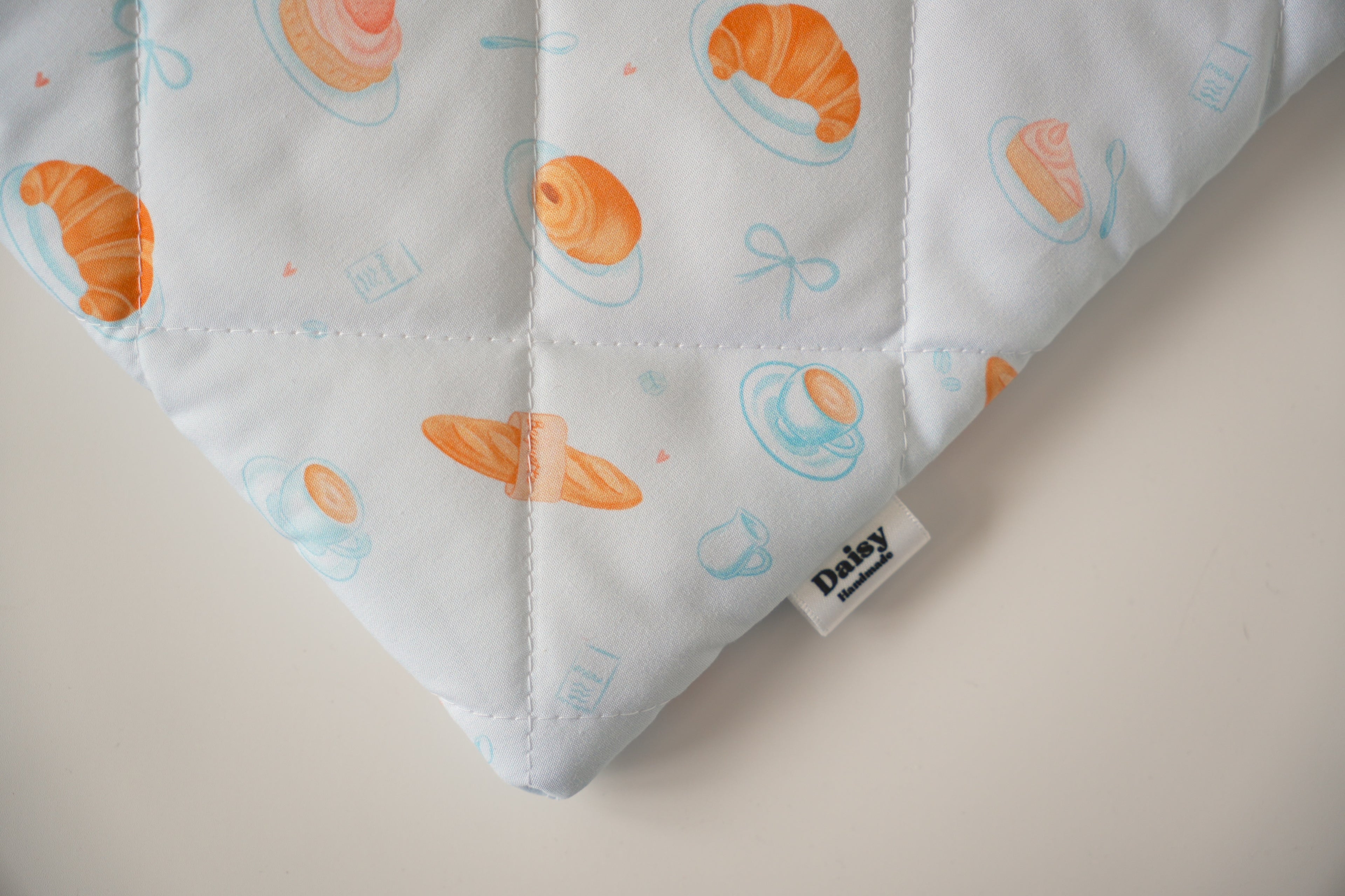 Quilted blue bakery book sleeve