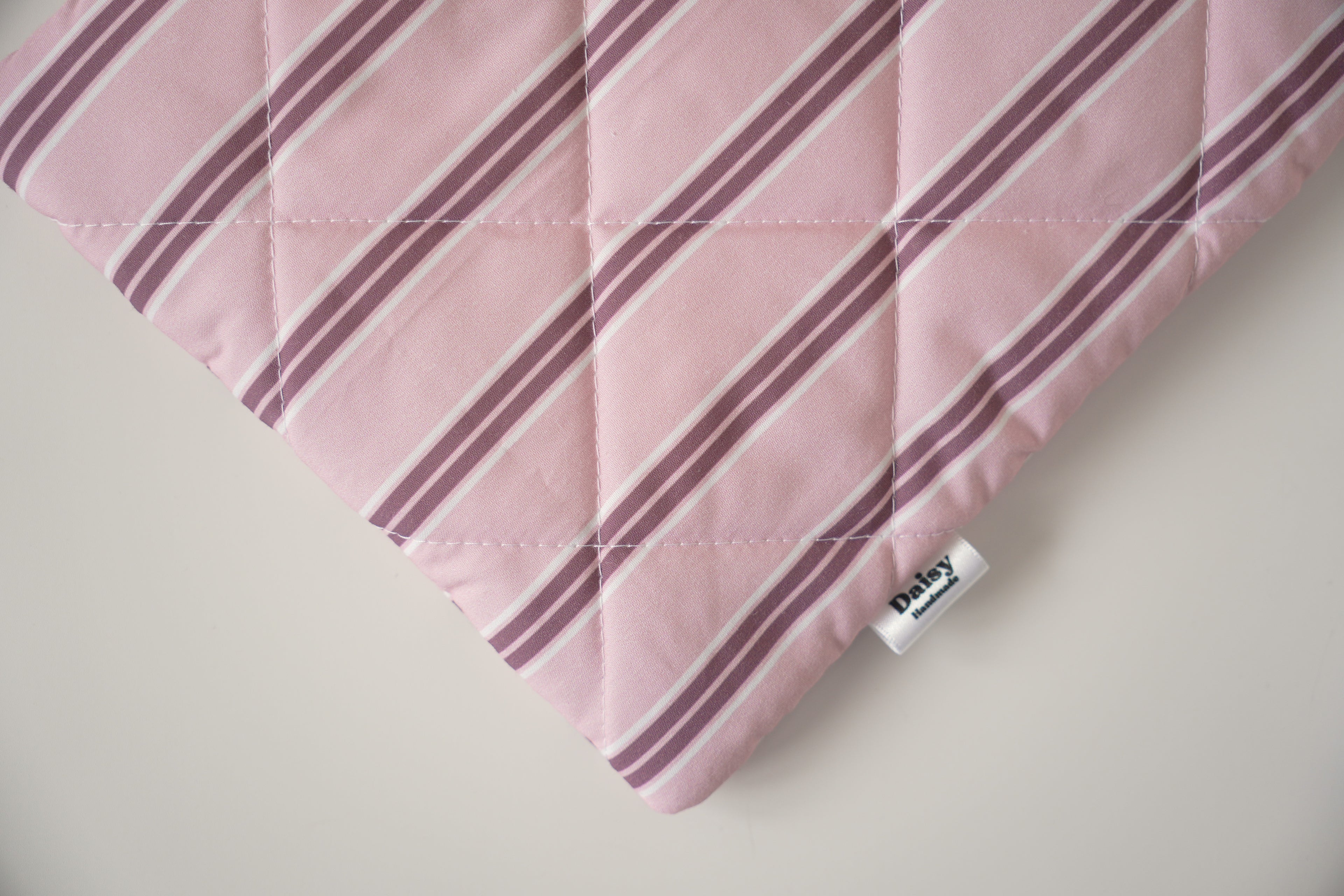 Quilted pink and maroon stripe book sleeve