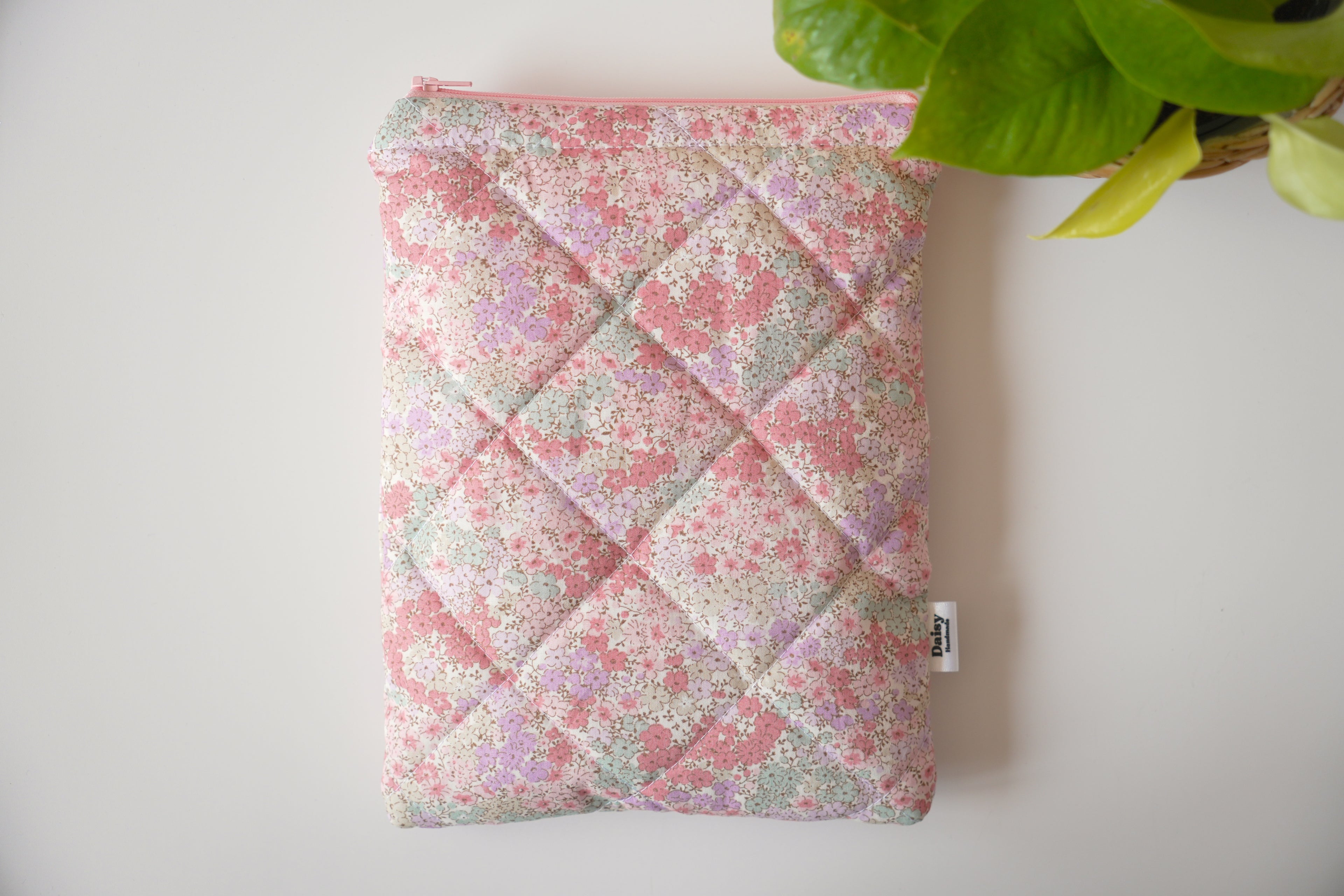 Quilted pink and teal floral book sleeve