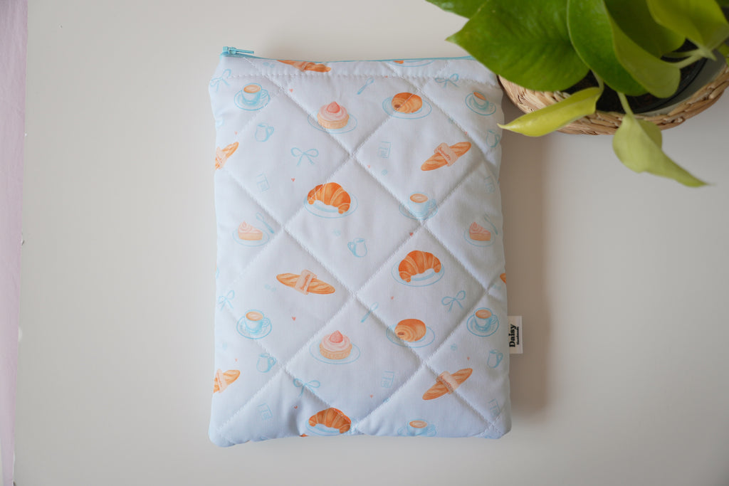 Quilted blue bakery book sleeve