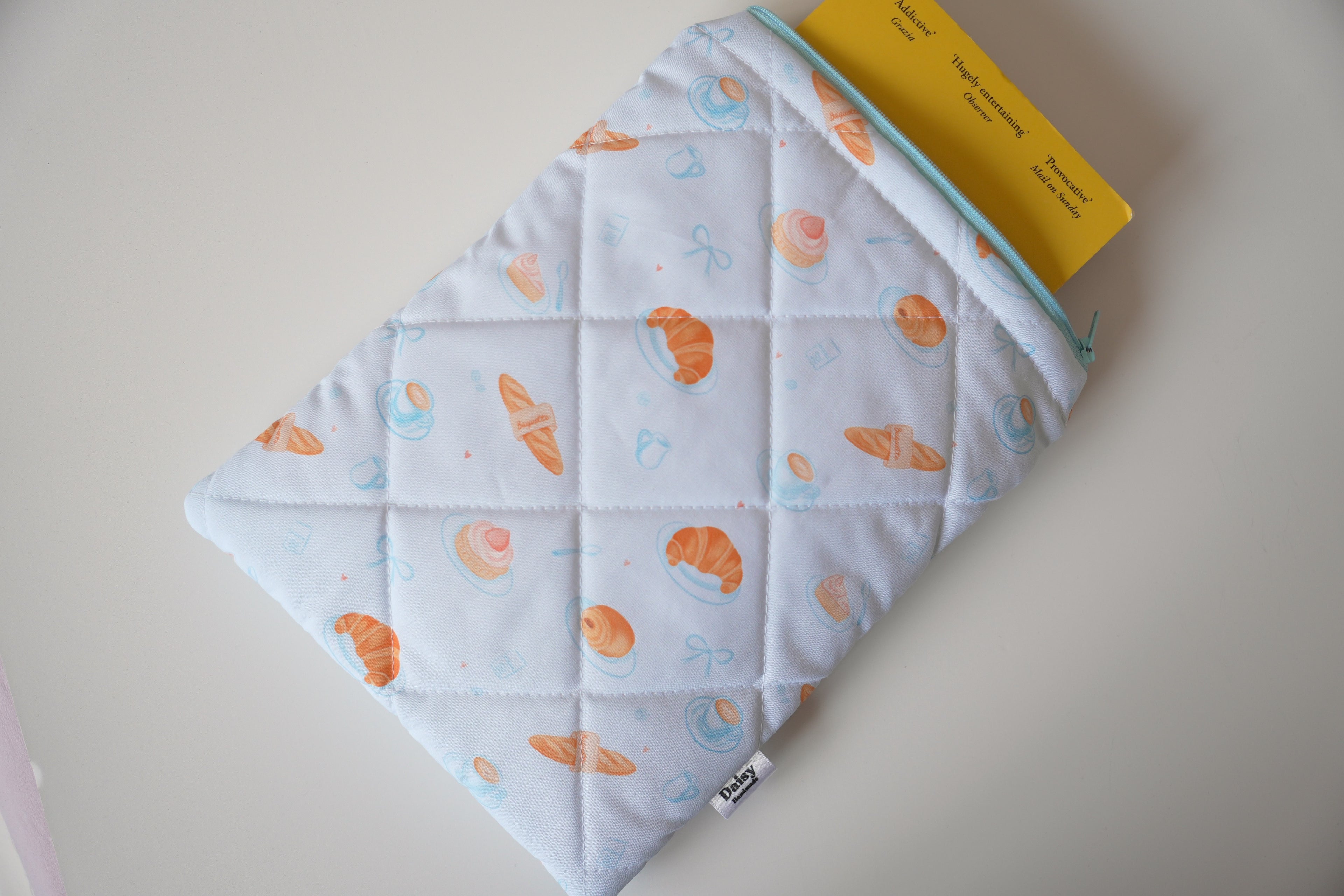 Quilted blue bakery book sleeve
