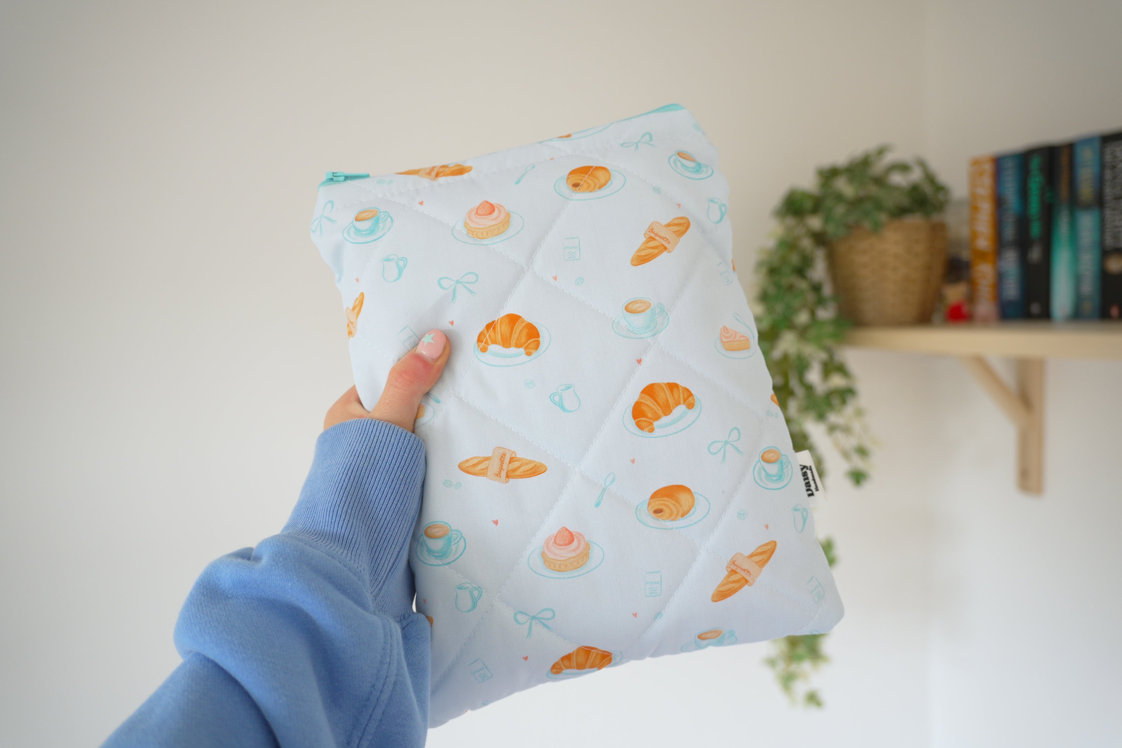 Quilted blue bakery book sleeve