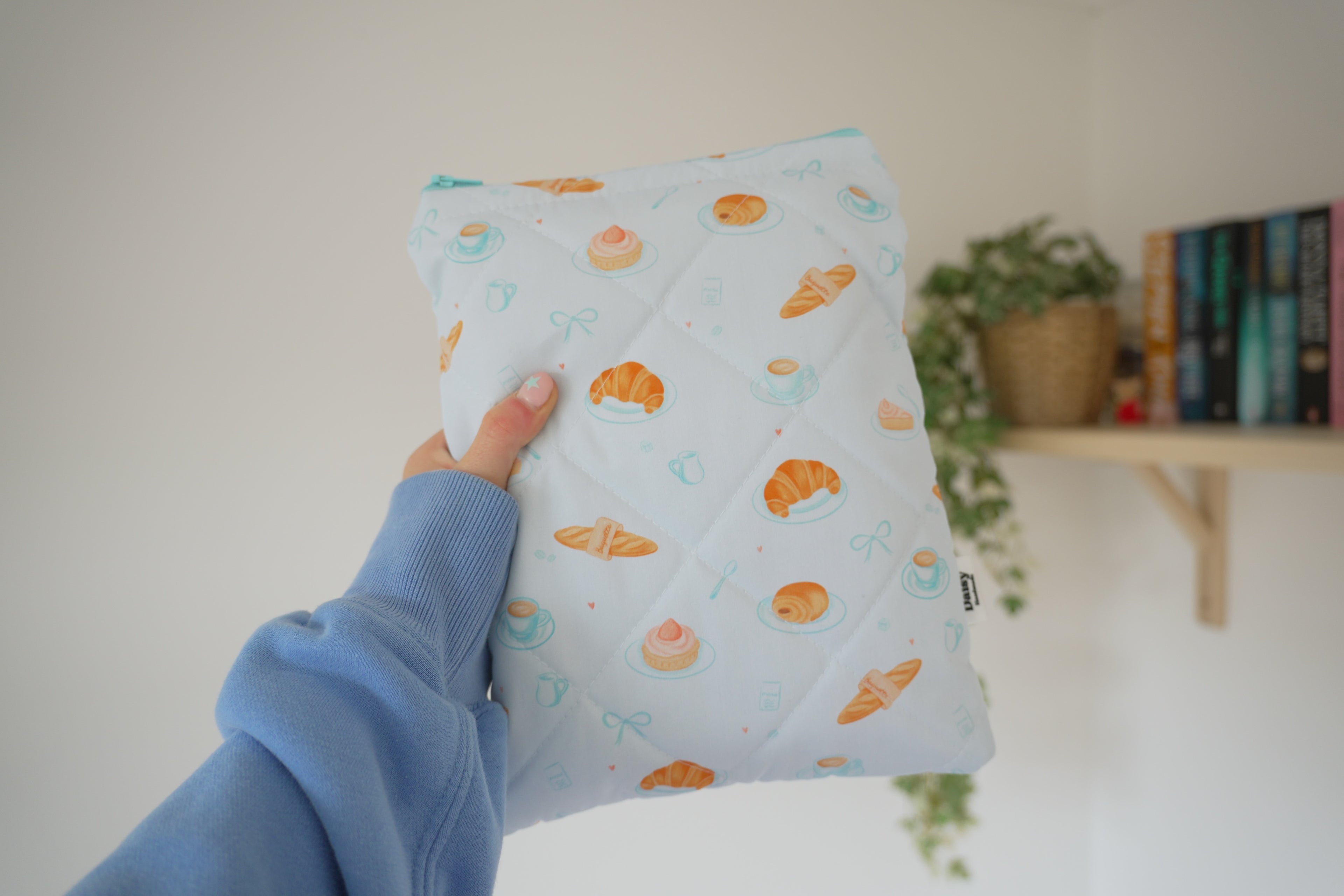 Quilted blue bakery book sleeve