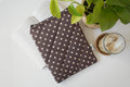 Quilted brown and yellow polka dot book sleeve