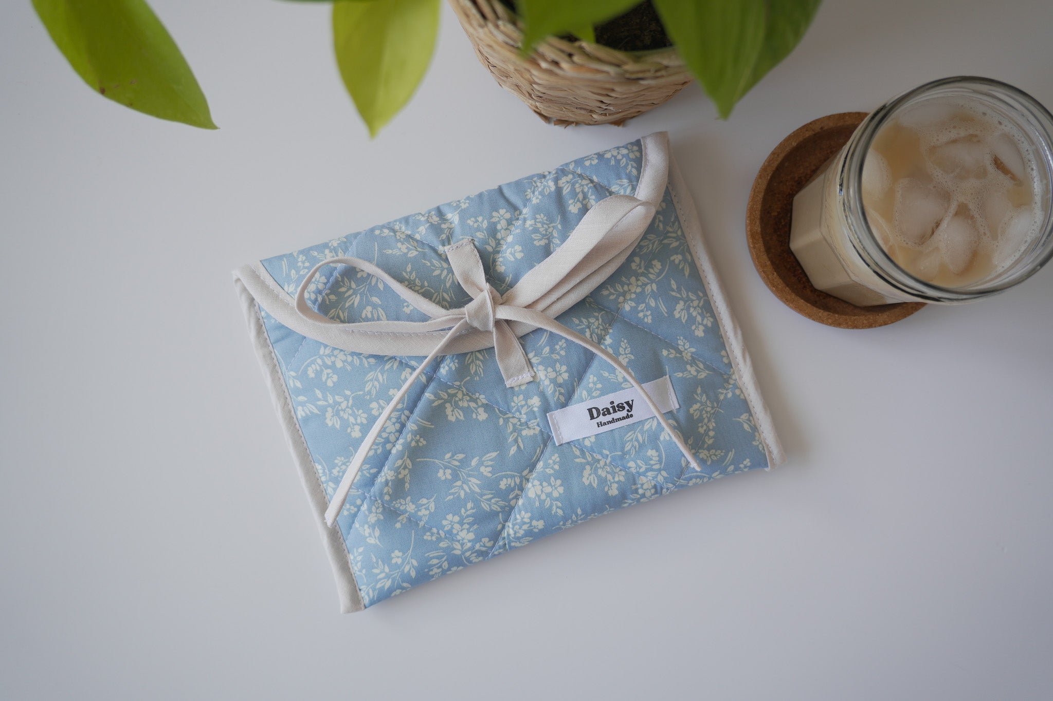 Quilted bow closure kindle sleeve in vintage blue floral