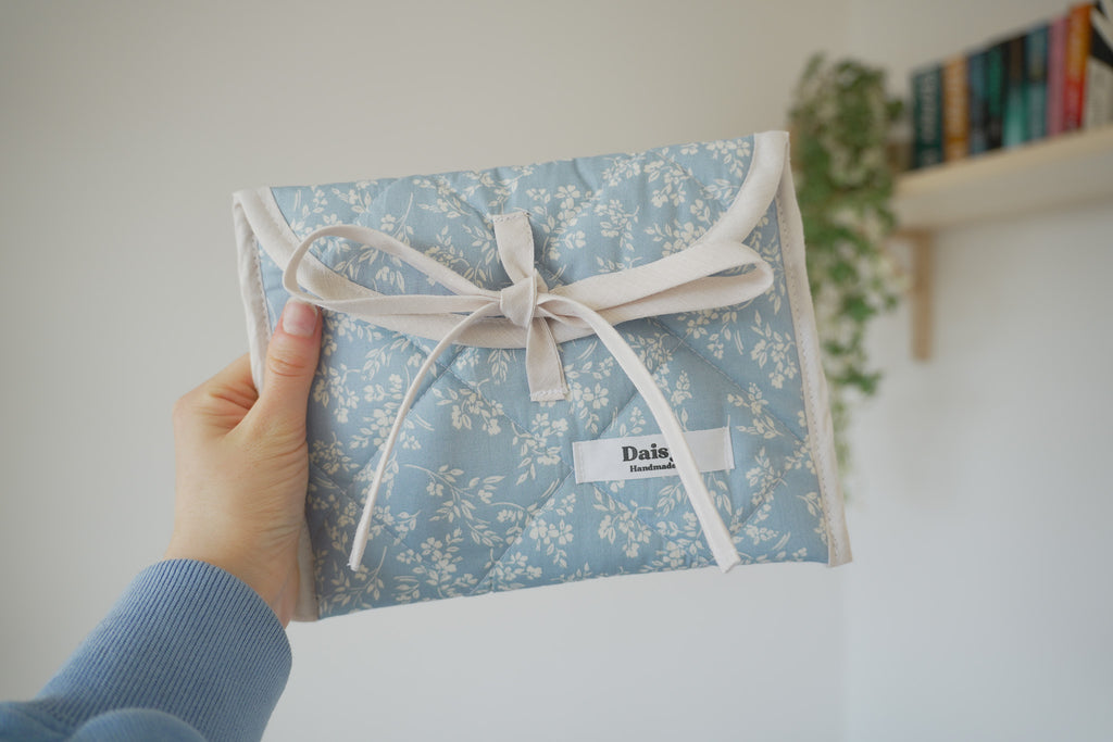 Quilted bow closure kindle sleeve in vintage blue floral