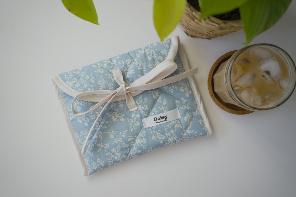 Quilted bow closure kindle sleeve in vintage blue floral
