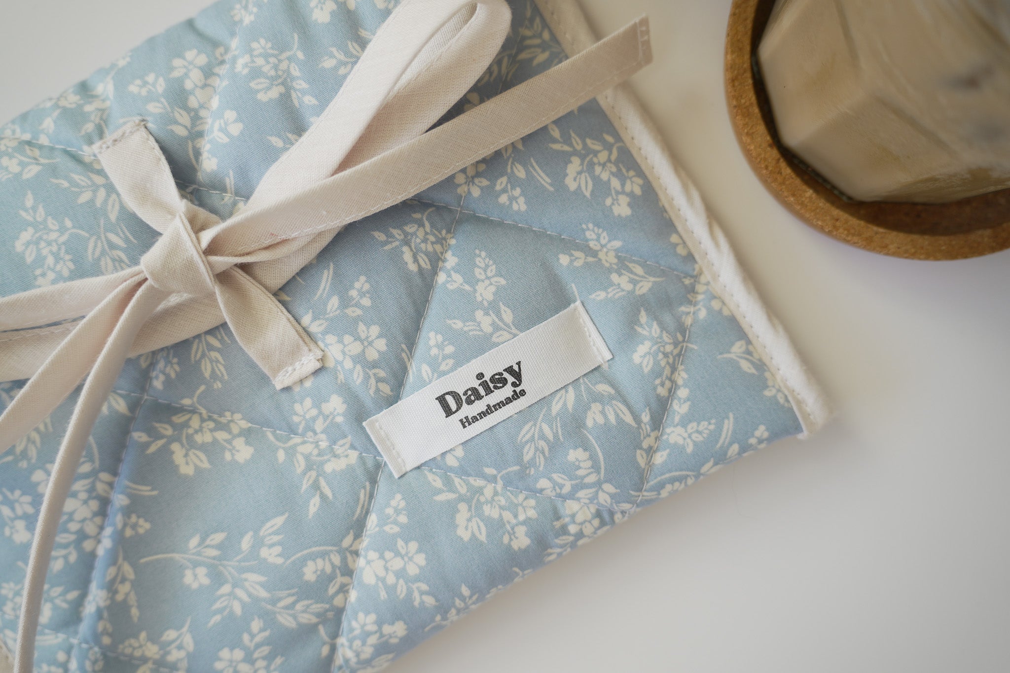 Quilted bow closure kindle sleeve in vintage blue floral