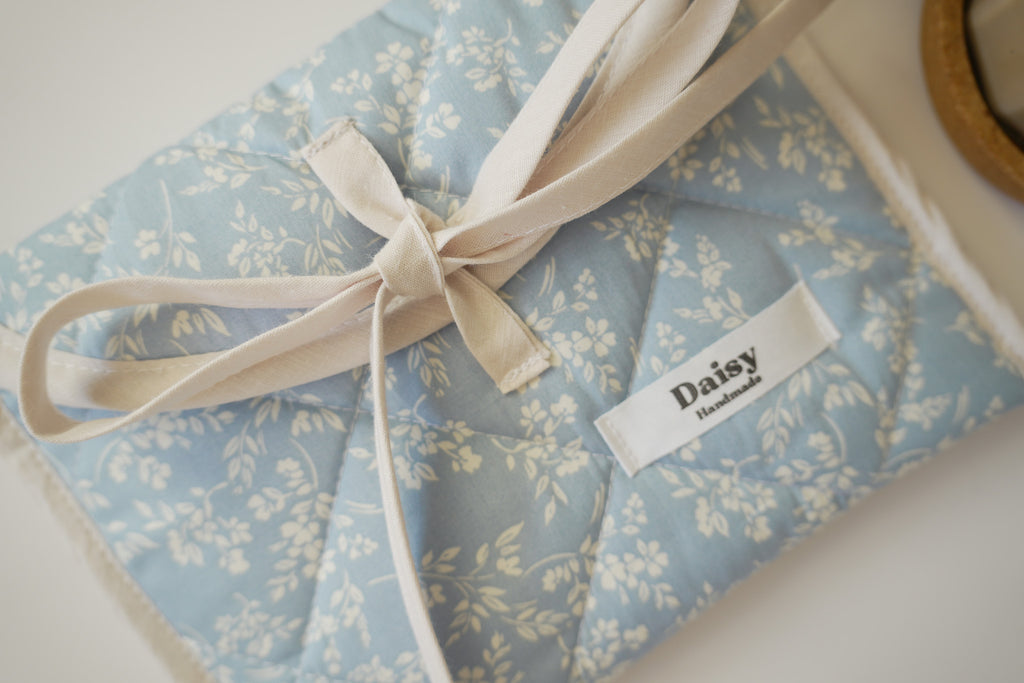 Quilted bow closure kindle sleeve in vintage blue floral
