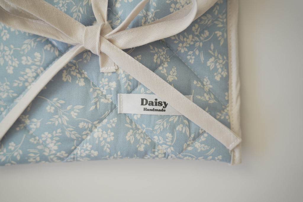 Quilted bow closure kindle sleeve in vintage blue floral