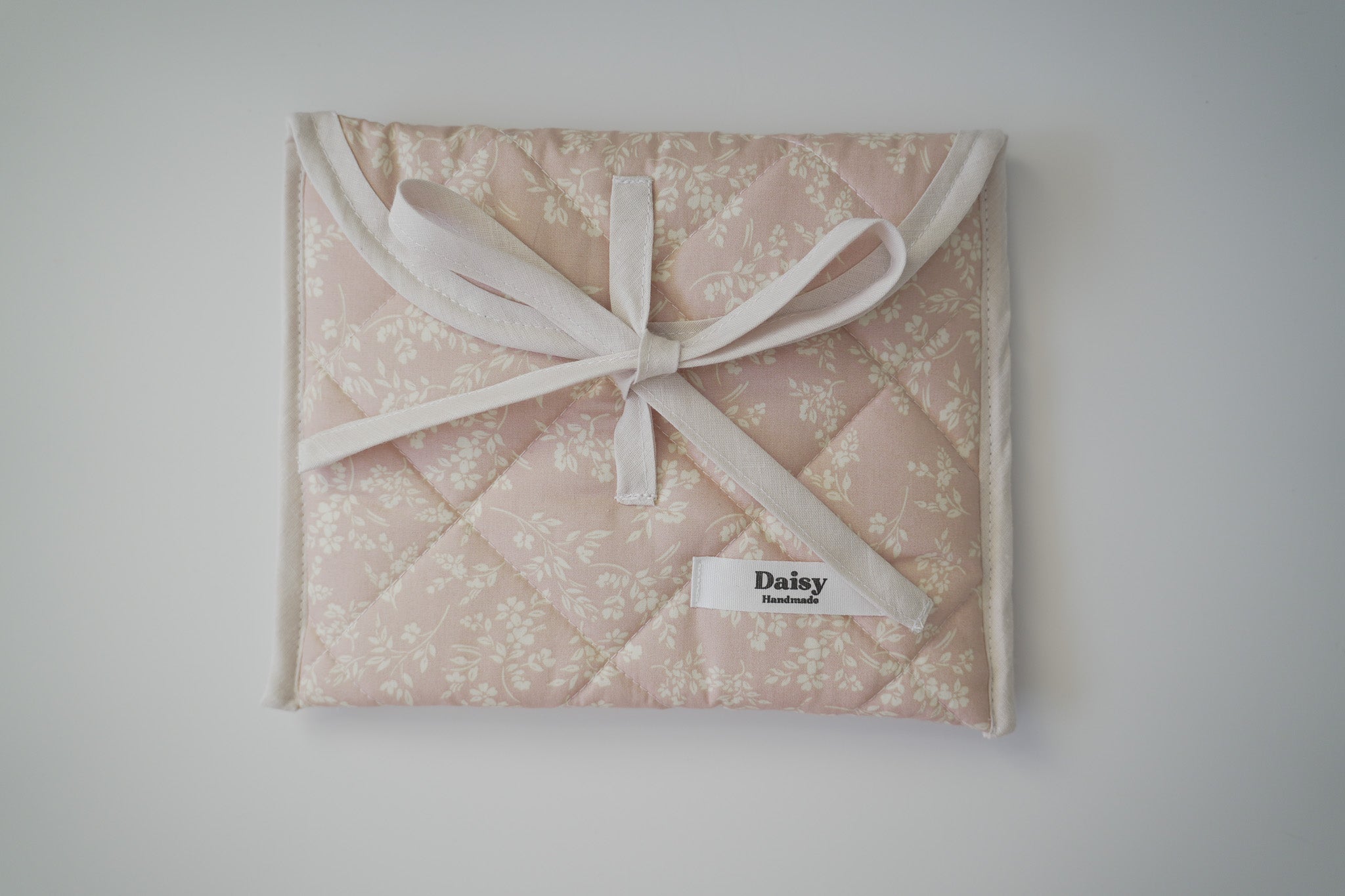 Quilted bow closure kindle sleeve in vintage pink floral