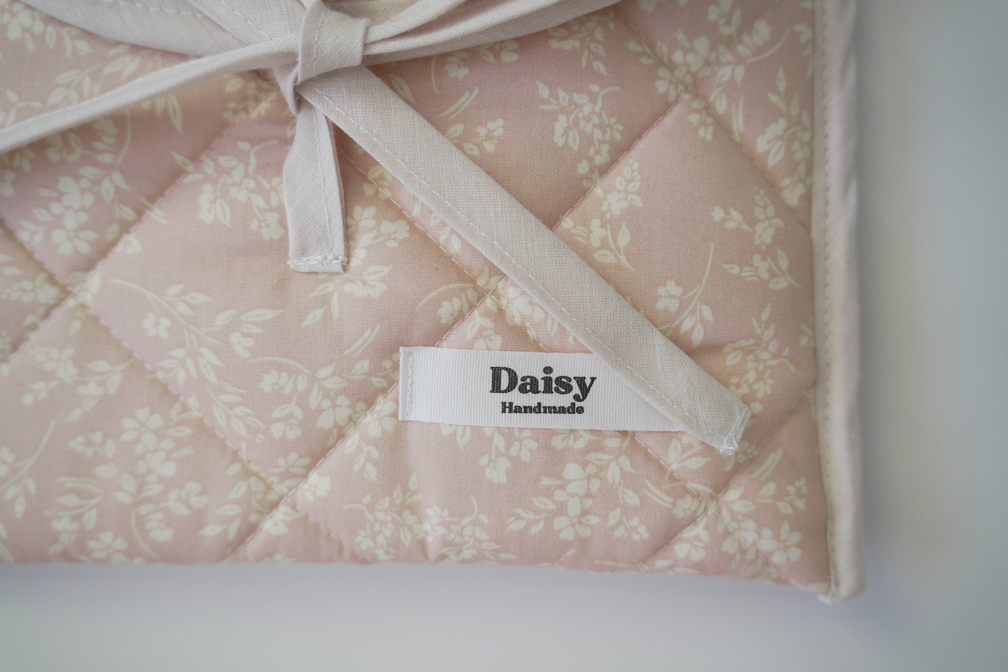 Quilted bow closure kindle sleeve in vintage pink floral