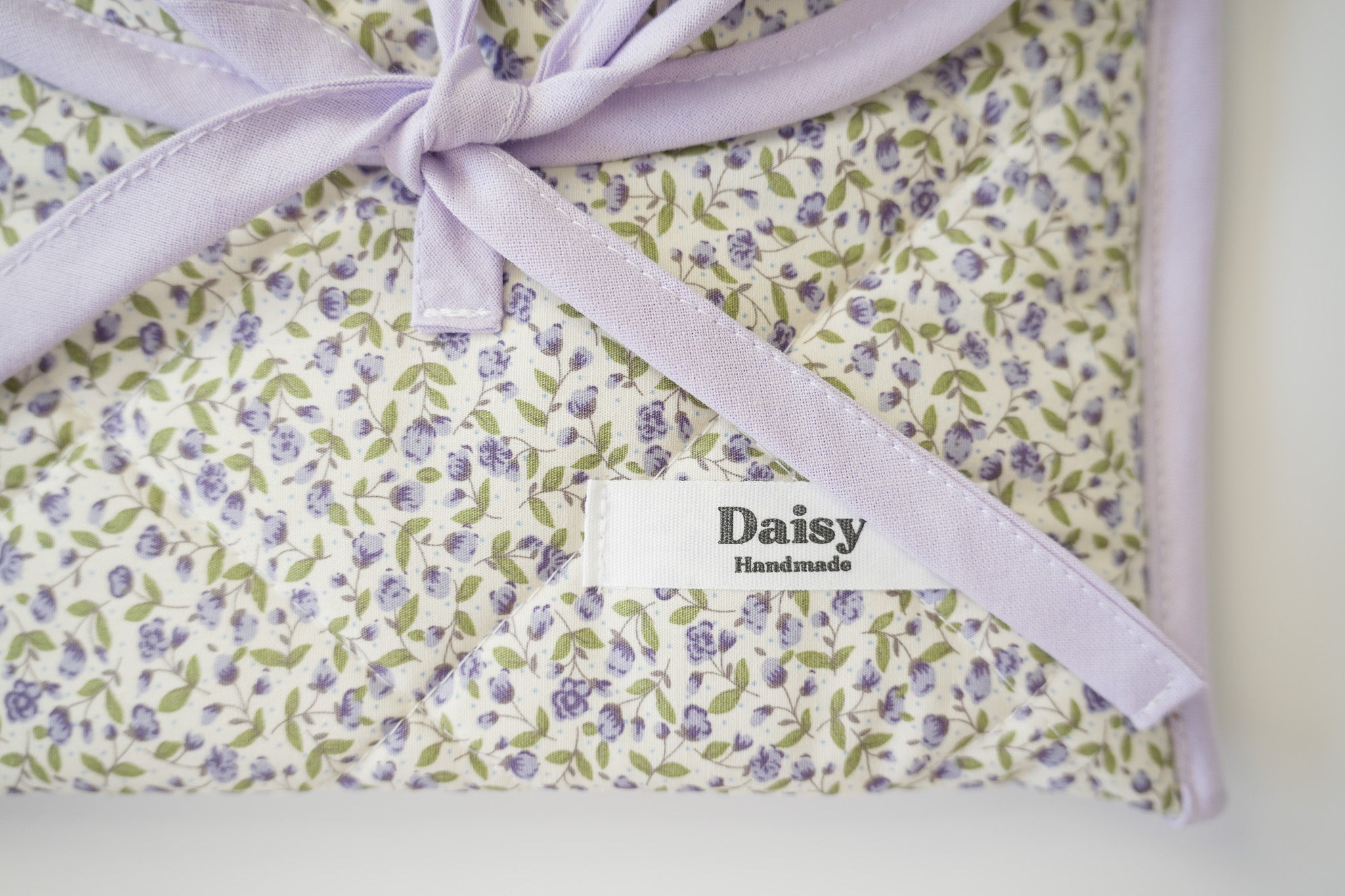 Quilted bow closure kindle sleeve purple rose buds