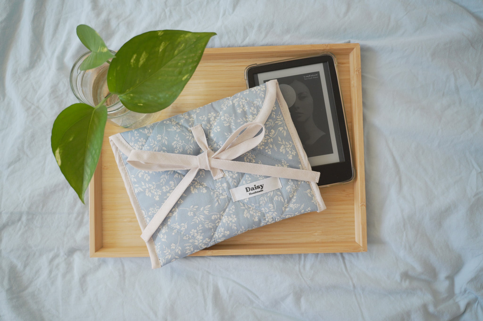 Quilted bow closure kindle sleeve in vintage blue floral