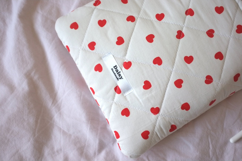 Laptop sleeve with pocket heart